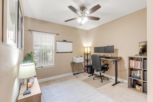 carpeted office with ceiling fan