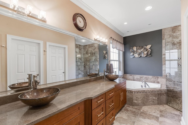 bathroom featuring vanity, shower with separate bathtub, and ornamental molding