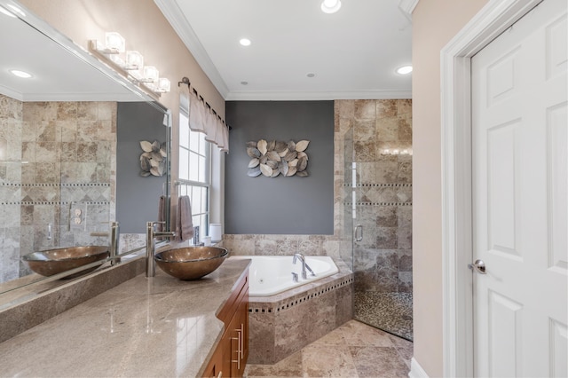 bathroom with plus walk in shower, vanity, and ornamental molding