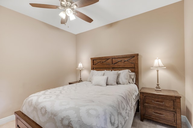 bedroom with ceiling fan and light colored carpet