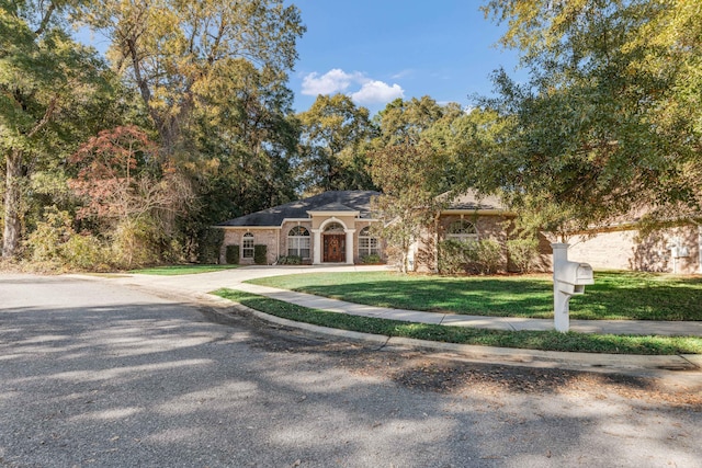 view of front of property with a front lawn