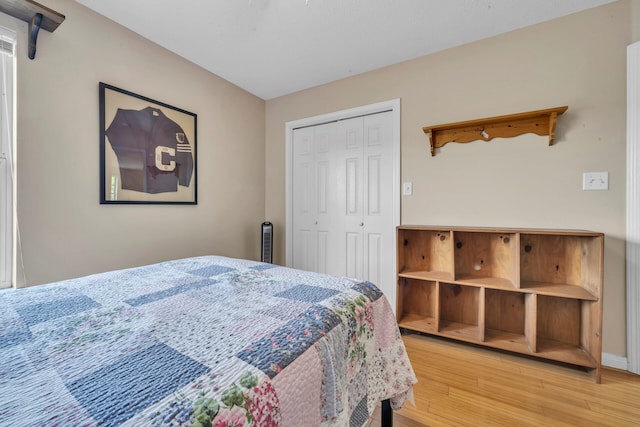 bedroom featuring light hardwood / wood-style floors and a closet