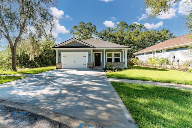 view of front facade with a garage and a front lawn