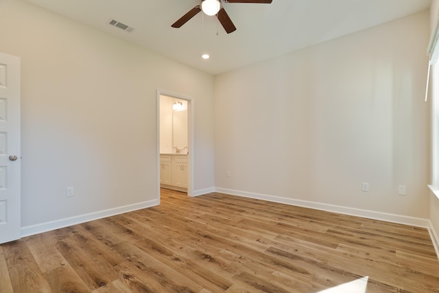 spare room with ceiling fan and light hardwood / wood-style floors