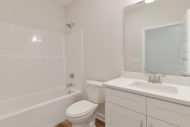 full bathroom with shower / washtub combination, vanity, wood-type flooring, and toilet