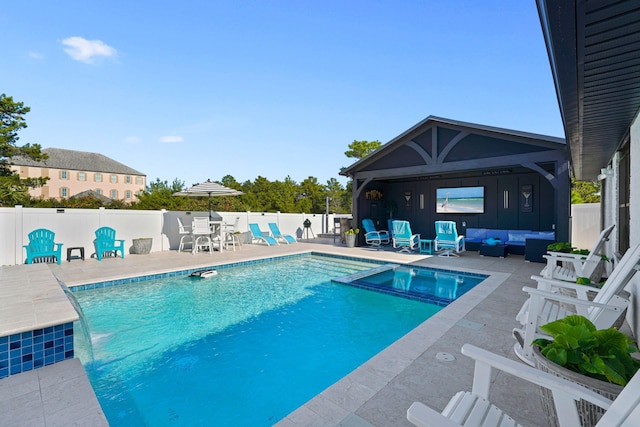 view of swimming pool featuring outdoor lounge area and a patio