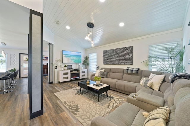 living room with dark hardwood / wood-style floors, a healthy amount of sunlight, wood ceiling, and vaulted ceiling