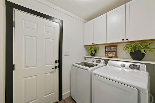 237 Sandy Cay Dr, Miramar Beach, FL 32550 - laundry room featuring cabinet space, washing machine and dryer, and wood finished floors