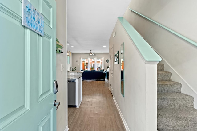 entryway with ceiling fan and light wood-type flooring