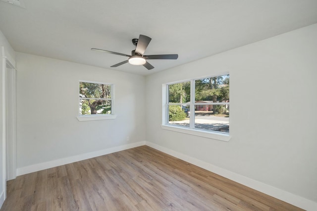 unfurnished room featuring ceiling fan and light wood-type flooring