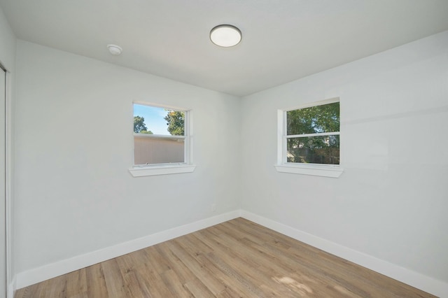 unfurnished room featuring wood-type flooring