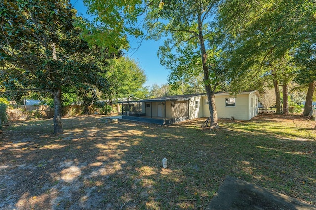 view of yard featuring a sunroom