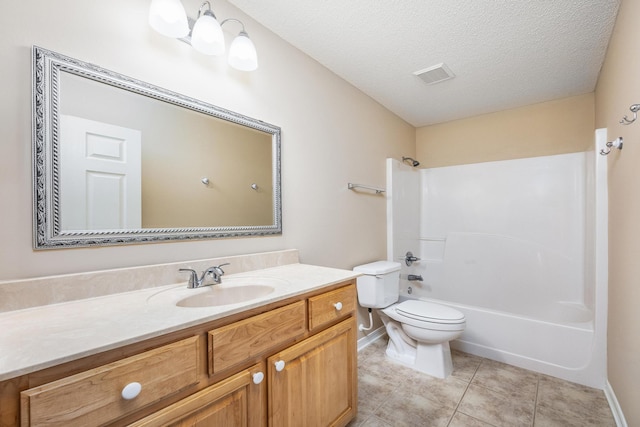 full bathroom featuring vanity, bathing tub / shower combination, tile patterned flooring, toilet, and a textured ceiling