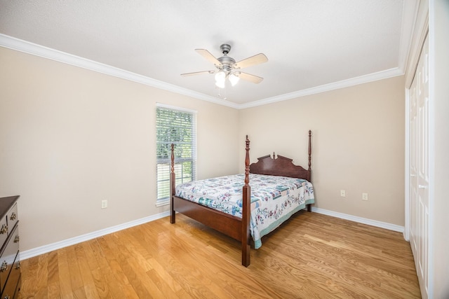 bedroom with wood-type flooring, a closet, ceiling fan, and ornamental molding