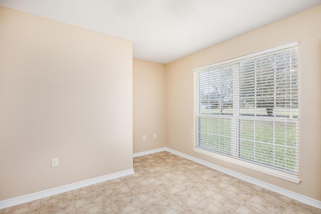 unfurnished room featuring a healthy amount of sunlight