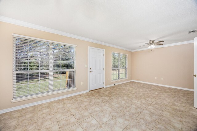 interior space featuring ceiling fan, crown molding, and a textured ceiling