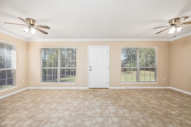 tiled empty room featuring crown molding, ceiling fan, and a textured ceiling