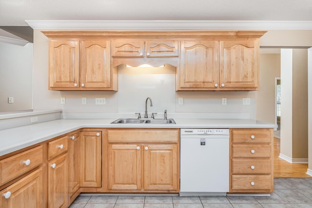 kitchen featuring a textured ceiling, dishwasher, light tile patterned floors, and sink