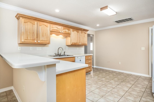 kitchen with a breakfast bar area, crown molding, sink, and a textured ceiling