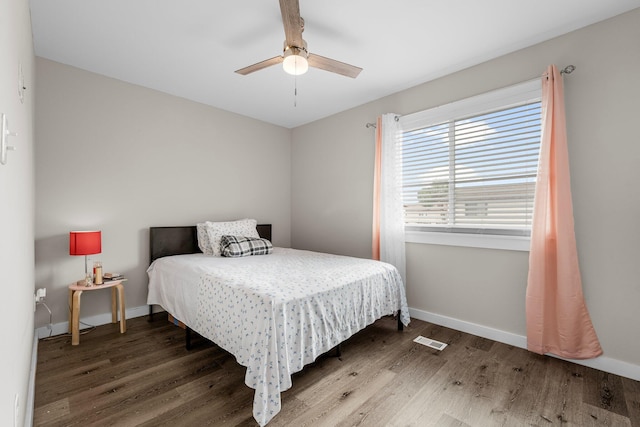 bedroom featuring hardwood / wood-style floors and ceiling fan