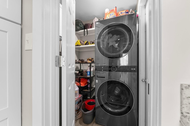 laundry area featuring stacked washer and clothes dryer