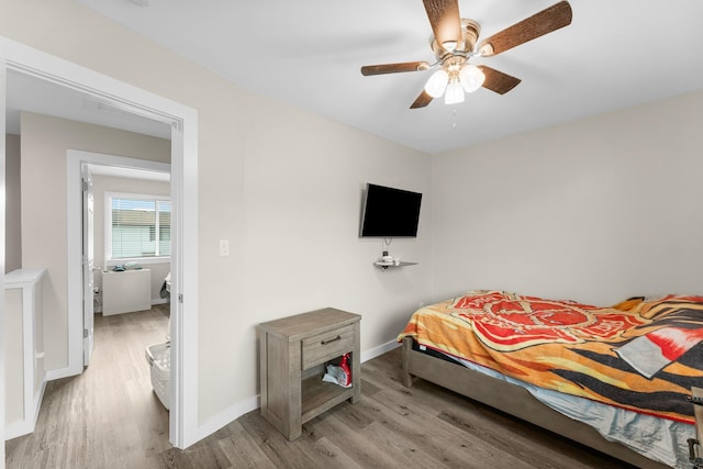 bedroom with light hardwood / wood-style flooring and ceiling fan