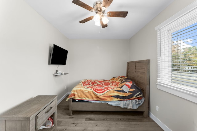 bedroom featuring light hardwood / wood-style floors and ceiling fan