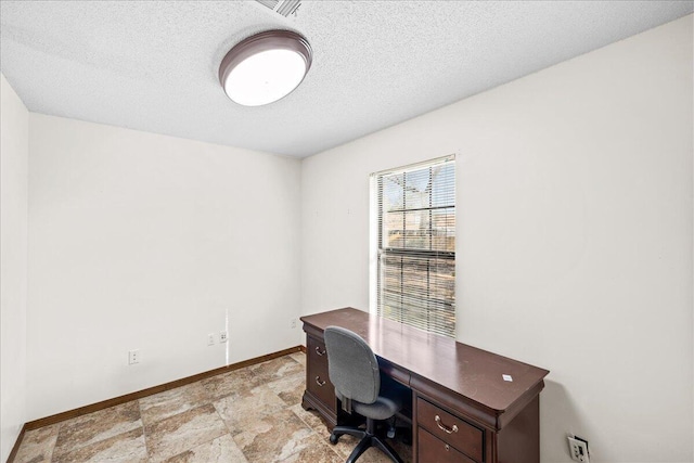 office space with a textured ceiling