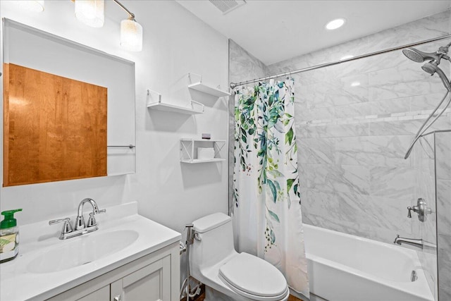 full bathroom featuring shower / bath combination with curtain, toilet, and vanity