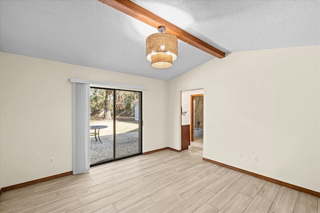 unfurnished room featuring a notable chandelier, lofted ceiling with beams, light wood-type flooring, and a textured ceiling