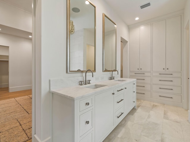 bathroom featuring vanity and wood-type flooring