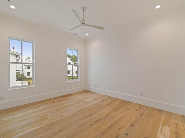 unfurnished room featuring light hardwood / wood-style flooring, ceiling fan, and ornamental molding