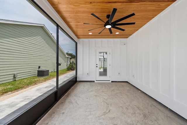 unfurnished sunroom featuring ceiling fan and wood ceiling