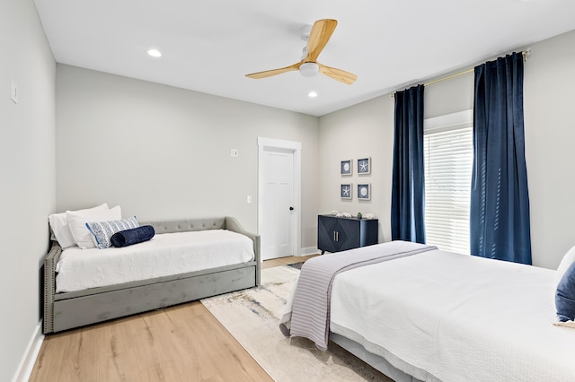 bedroom featuring hardwood / wood-style flooring and ceiling fan