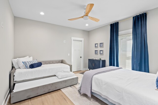 bedroom featuring hardwood / wood-style floors and ceiling fan