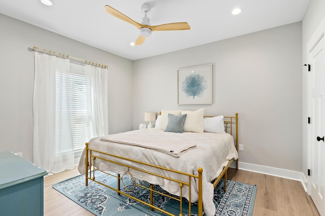 bedroom featuring hardwood / wood-style flooring and ceiling fan