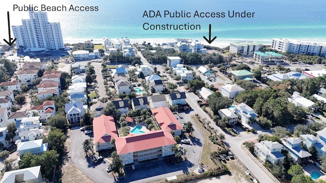 aerial view featuring a water view and a view of the beach