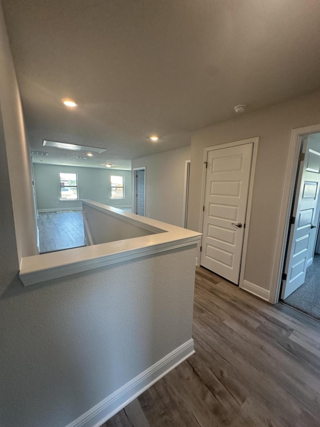 hallway featuring dark hardwood / wood-style floors