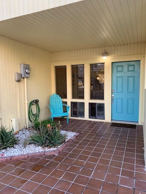 doorway to property with a patio area