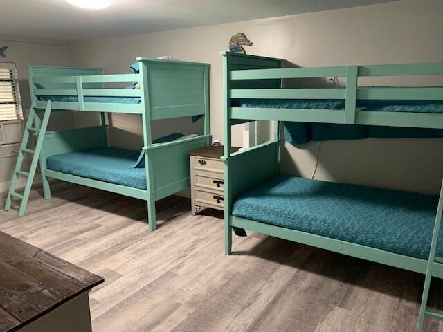 bedroom featuring wood-type flooring