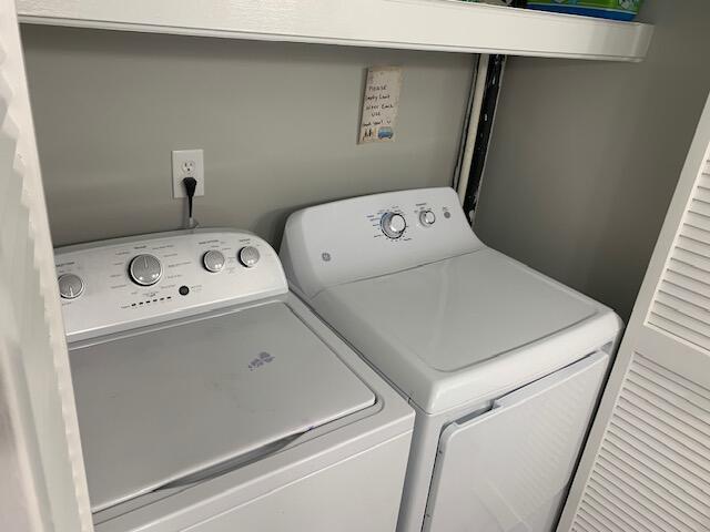 laundry area with independent washer and dryer