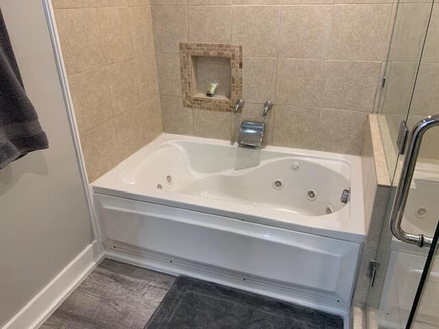 bathroom with separate shower and tub