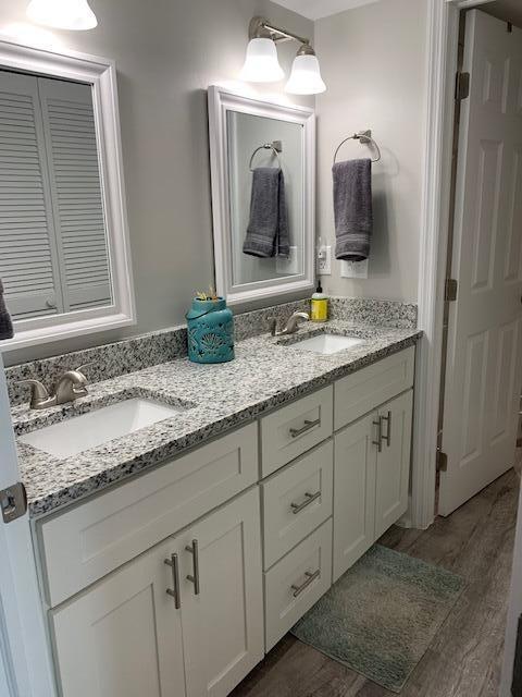 bathroom featuring hardwood / wood-style floors and vanity