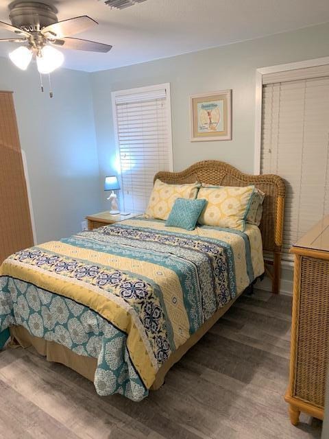 bedroom featuring wood-type flooring and ceiling fan