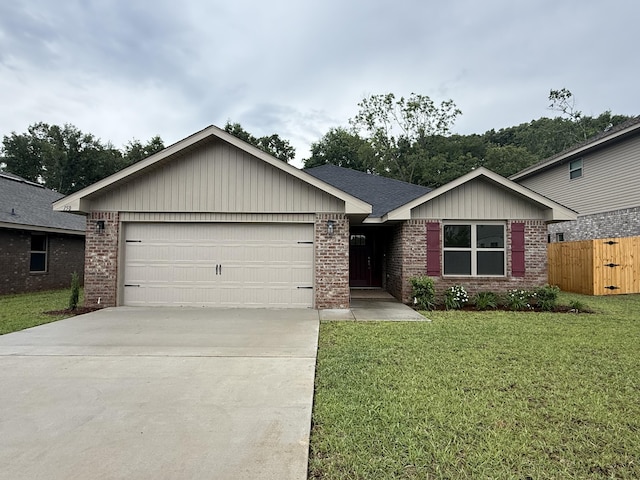 150 Ridgeway Cir, Crestview, FL 32536 - ranch-style house with brick siding, a garage, and driveway