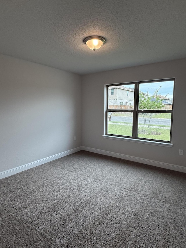 150 Ridgeway Cir, Crestview, FL 32536 - carpeted empty room featuring healthy amount of natural light and a textured ceiling
