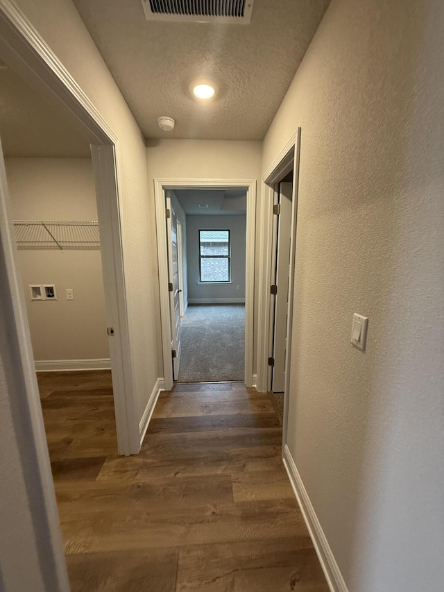 150 Ridgeway Cir, Crestview, FL 32536 - hall with wood finished floors and a textured ceiling