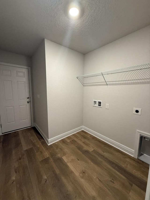 150 Ridgeway Cir, Crestview, FL 32536 - washroom with electric dryer hookup, washer hookup, dark wood-style floors, and a textured ceiling