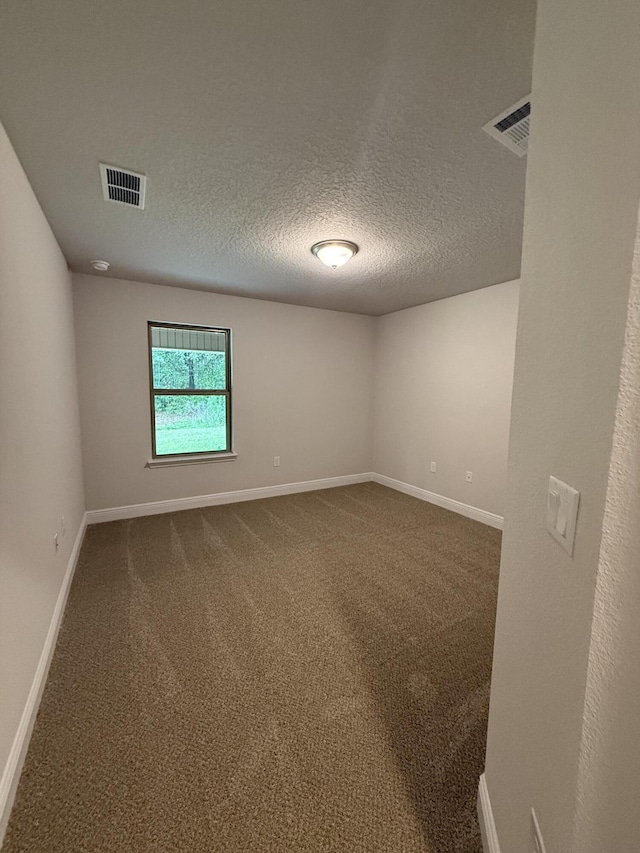 150 Ridgeway Cir, Crestview, FL 32536 - empty room featuring dark colored carpet and a textured ceiling