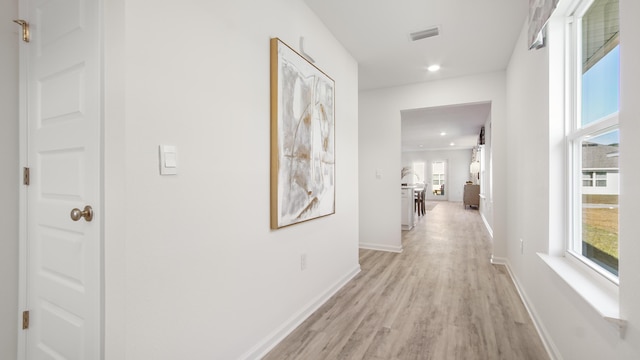 hall with light wood-type flooring